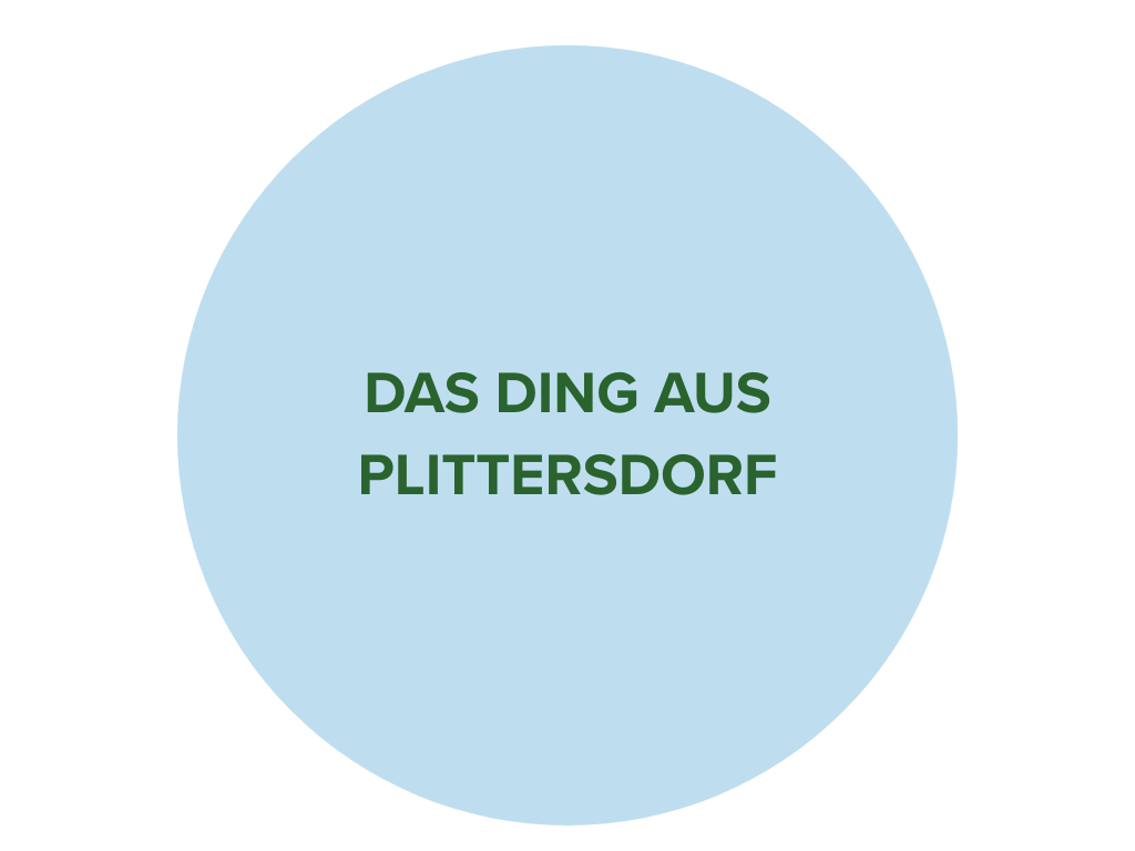Hellblauer Kreis mit dunkelgrünem Schriftzug "Das Ding aus Plittersdorf".